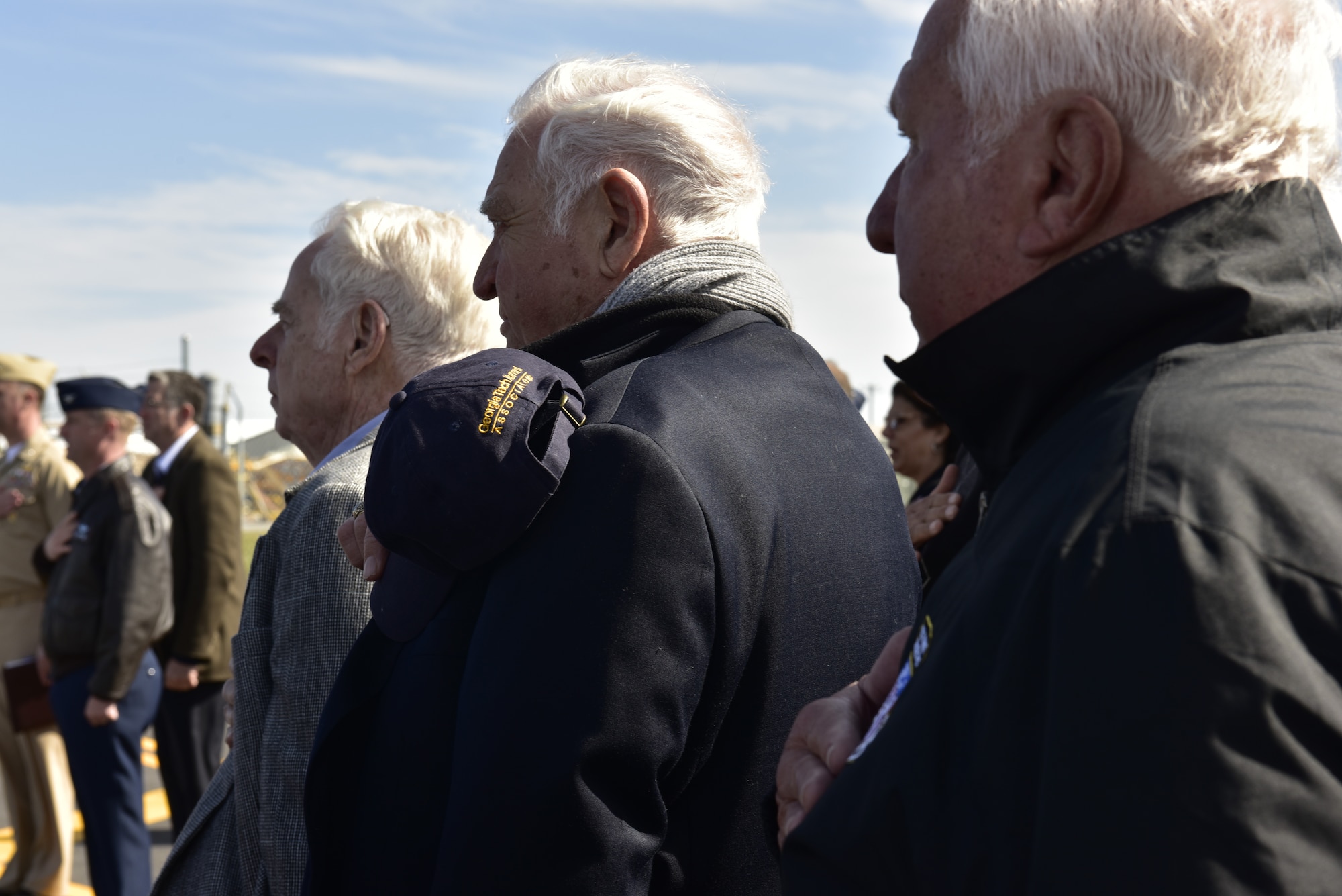 Members of the Great American Defense Community render honors during the playing of the national anthem at the beginning of an award ceremony with the Great American Defense Community at Tyndall Air Force Base, Fla., Feb. 13, 2019. Tyndall was awarded the Great American Defense Community Award for 2019 with a commemorative logo painted on the water tower to represent Bay County’s accomplishments. Bay County is one of five communities across the country to be named a Great American Defense Community in 2019.  (U.S. Air Force photo by Staff Sgt. Alexandre Montes)