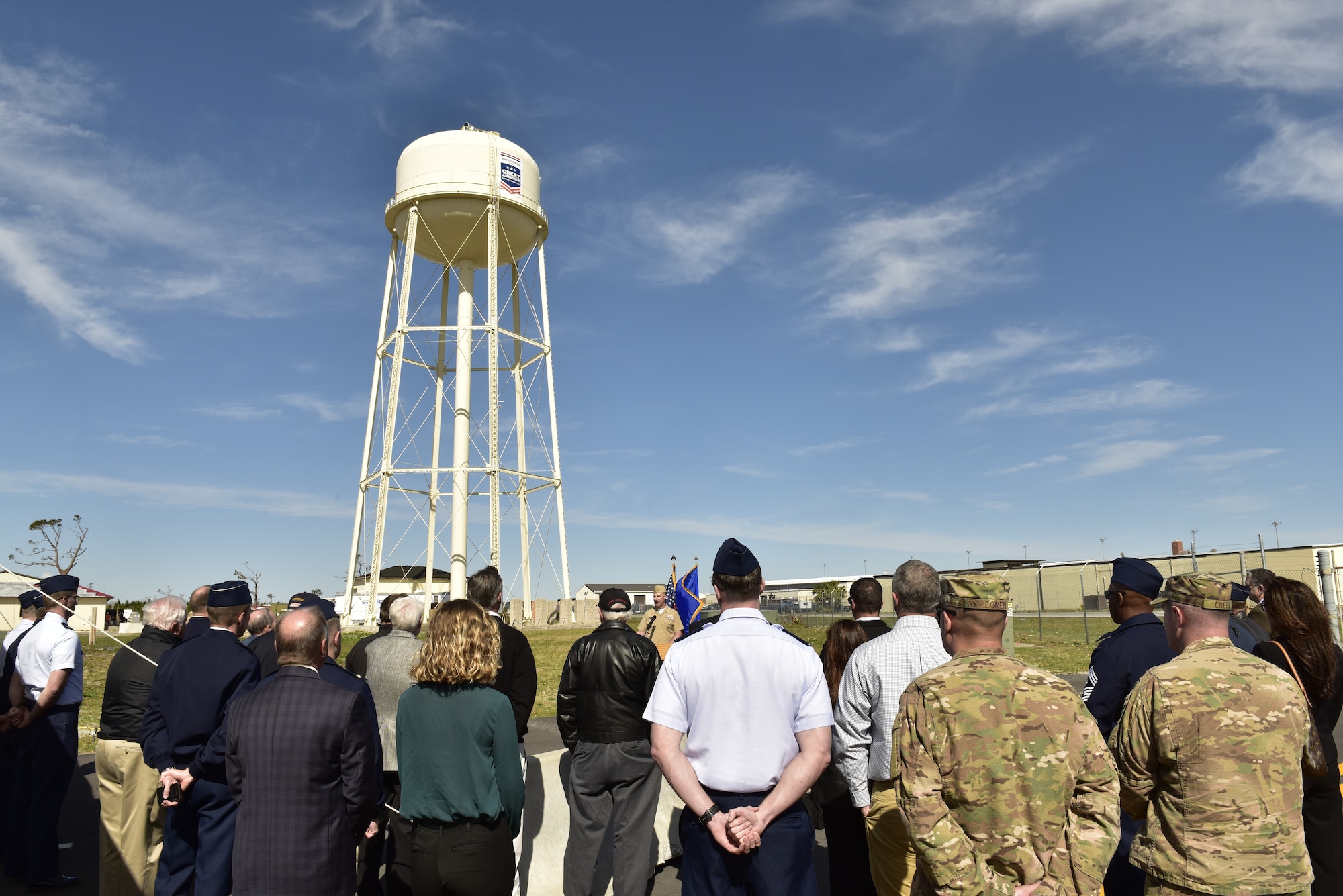 U.S. Navy Cmdr. Jay Sego, Naval Support Activity-Panama City commanding officer, gives his remarks about the importance of community support during an unveiling of a logo on the base water tower at Tyndall Air Force Base, Fla., Feb. 13, 2019. Tyndall was awarded the Great American Defense Community Award for 2019 with a commemorative logo painted on the water tower to represent Bay County’s accomplishments. Bay County is one of five communities across the country to be named a Great American Defense Community in 2019. (U.S. Air Force photo by Staff Sgt. Alexandre Montes)