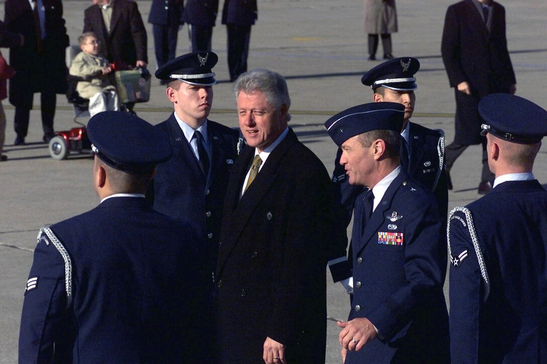 Former President of the United States, Williams Jefferson Clinton is escorted by Brig. Gen. Gregory H. Power, former 55th Wing commander at Offutt AFB, Nebraska upon his arrival on Dec. 8, 2000.