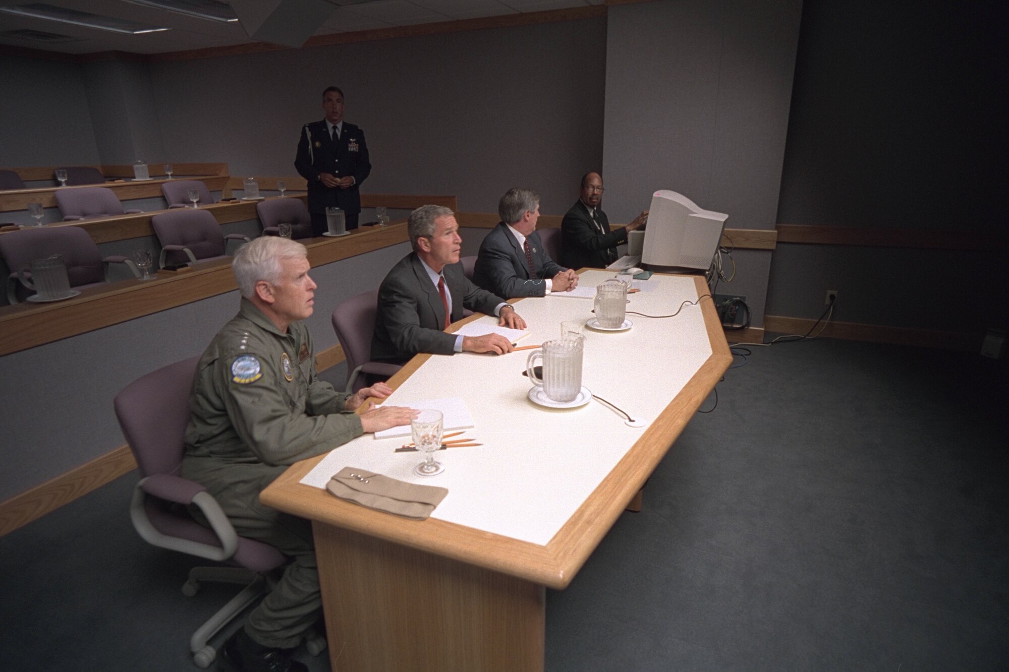 President George W. Bush, Admiral Richard Mies, left, and White House Chief of Staff Andy Card conduct a video teleconference Tuesday Sept. 11, 2001, at Offutt Air Force Base in Nebraska.