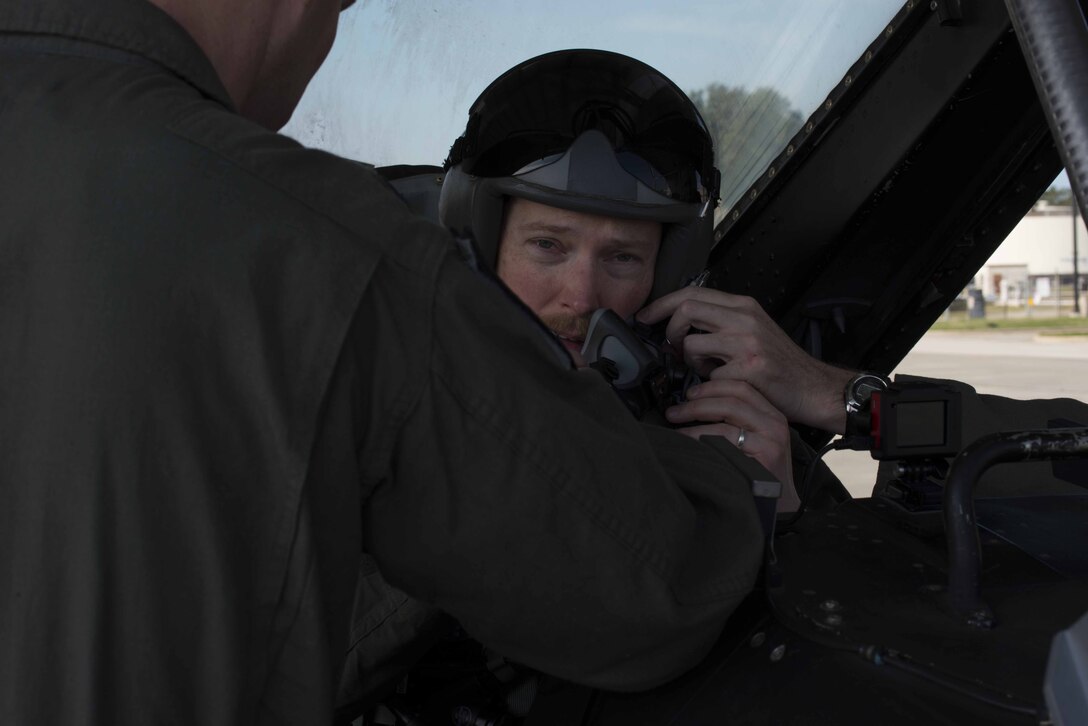 Col. Derek O’Malley, 20th Fighter Wing commander, helps Doug Heder, Executive Producer of Activisions DESTINY game franchise, adjust his mask for an F-16DM Fighting Falcon civic leader flight at Shaw Air Force Base, S.C., Feb. 8, 2019.