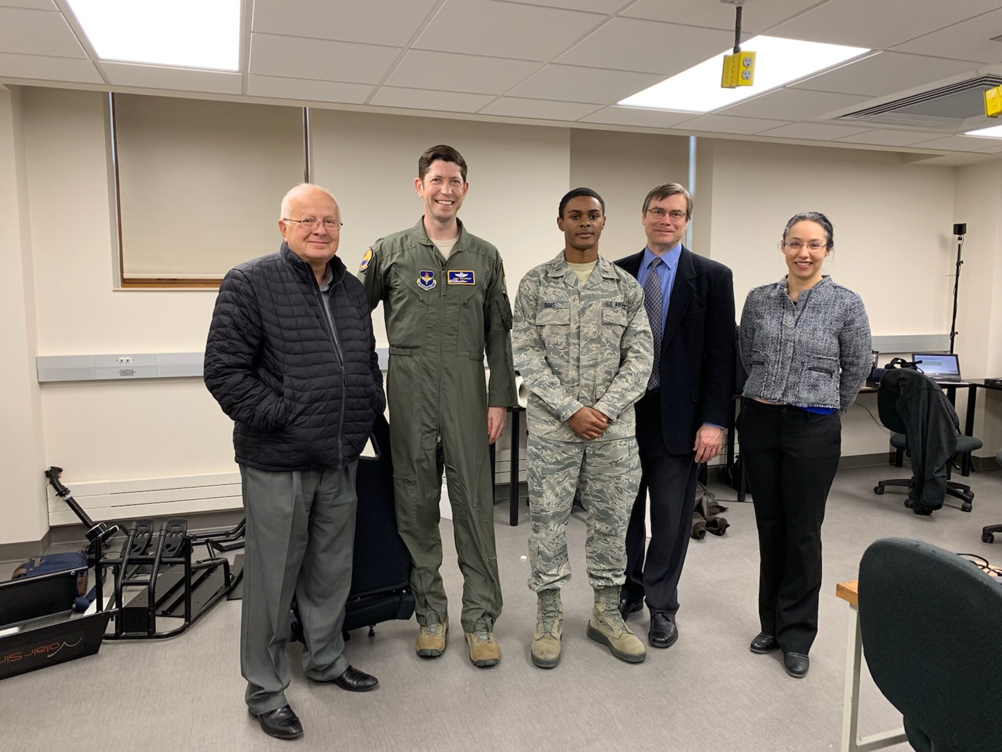 Air Education and Training Command is partnering with the South Dakota School of Mines and Technology on a project to enhance the capabilities of the virtual reality trainer used in pilot training. Standing in the school’s virtual reality lab are, from left, Dr. Jan Puszynski, SDSMT vice president of research; Lt. Col. Cory Waldroup, 99th Flying Training Squadron chief of innovations; 2nd Lt. Mitch Sims, 12th Training Squadron; Dr. Jeff McGough, SDSMT Computer Science and Engineering Department head; and Dr. Lisa Rebenitsch, SDSMT virtual reality lab director. AETC sent a VRT from the Pilot Training Next program in Austin to the South Dakota university so a technology team at the school can work on improving the trainer.