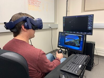 Dr. Jeff McGough, South Dakota School of Mines and Technology Computer Science and Engineering Department head, evaluates a virtual reality trainer sent from Air Education and Training Command’s Pilot Training Next program. A technology team at the school has begun work on improving the trainer used in pilot training.