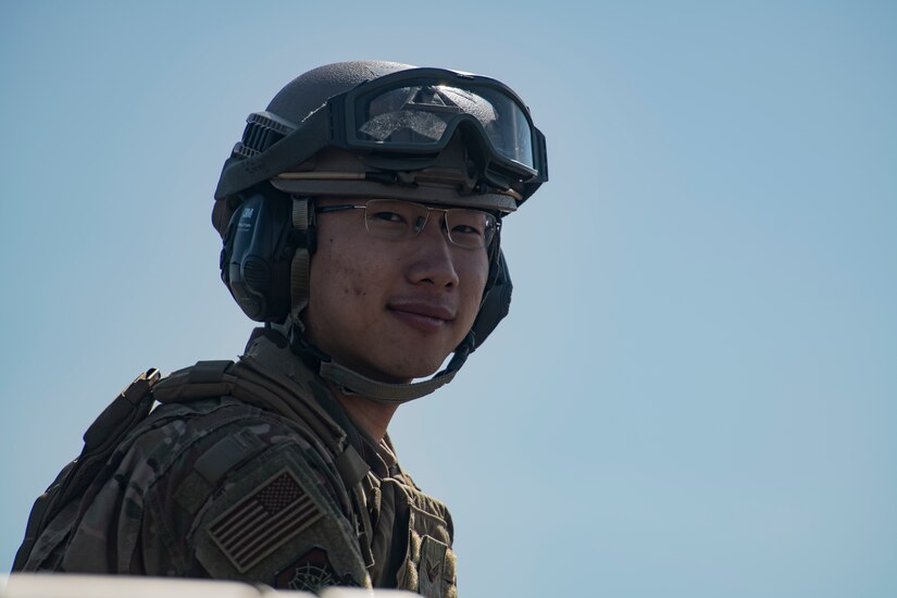 Senior Airman Joshua Kim, 621st Contingency Response Squadron aerial porter, awaits the arrival of a C-17 Globemaster III during Exercise Crescent Moon Feb. 12, 2019, at North Auxiliary Airfield in North, S.C.