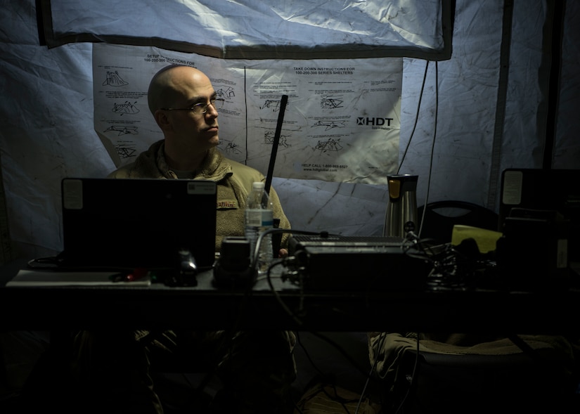 Master Sgt. Daniel Warder, 621st Contingency Response Squadron command and control NCO in charge, mans his post during Exercise Crescent Moon Feb. 12, 2019, at North Auxiliary Airfield in North, S.C