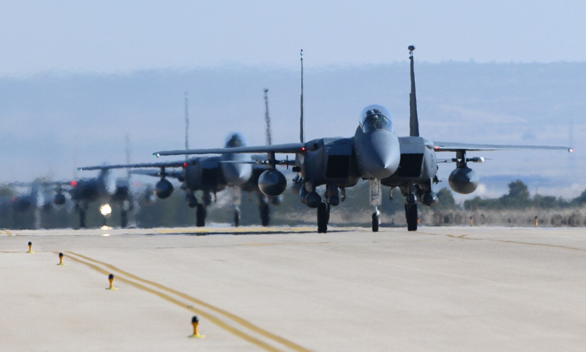 Four U.S. Air Force F-15E Strike Eagles from Royal Air Force Lakenheath, England, taxi down the flightline at Albacete Air Base, Spain, during the NATO Tactical Leadership Programme 19-1 flying course, Feb. 15, 2019. During TLP, U.S. Air Force F-15Es will conduct flying training with other NATO air forces including Spain, France, Greece, Italy, Germany, the United Kingdom and Belgium. (U.S. Air Force photo by Staff Sgt. Alex Fox Echols III)