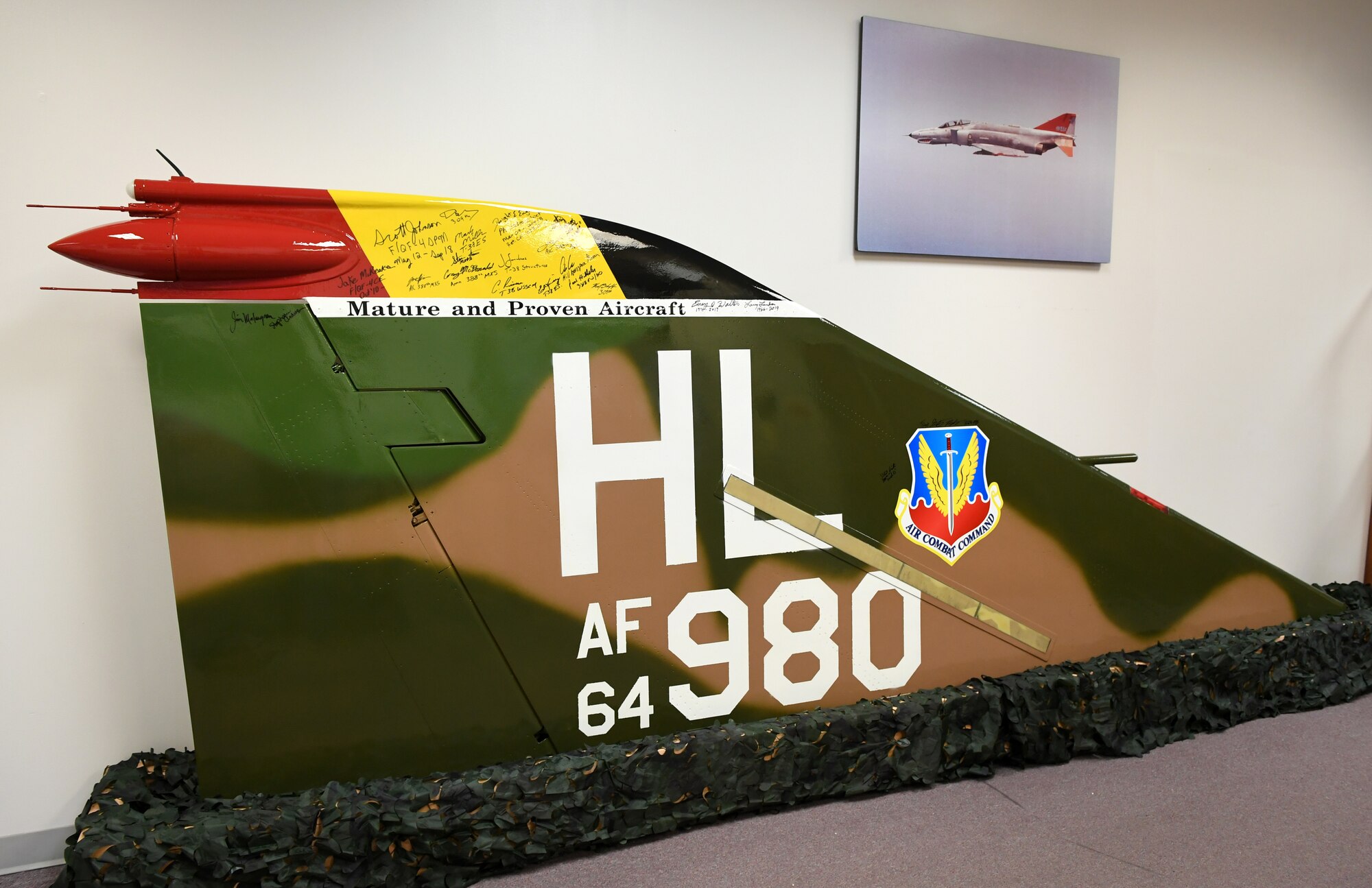 The newly painted tail of an F-4E Phantom stands on display at the Mature and Proven Aircraft Division headquarters at Hill Air Force Base, Utah. MAPA acquired the tail and restored it in Vietnam-era camouflage colors in honor of the 388th Fighter Wing that flew the aircraft during that time period.