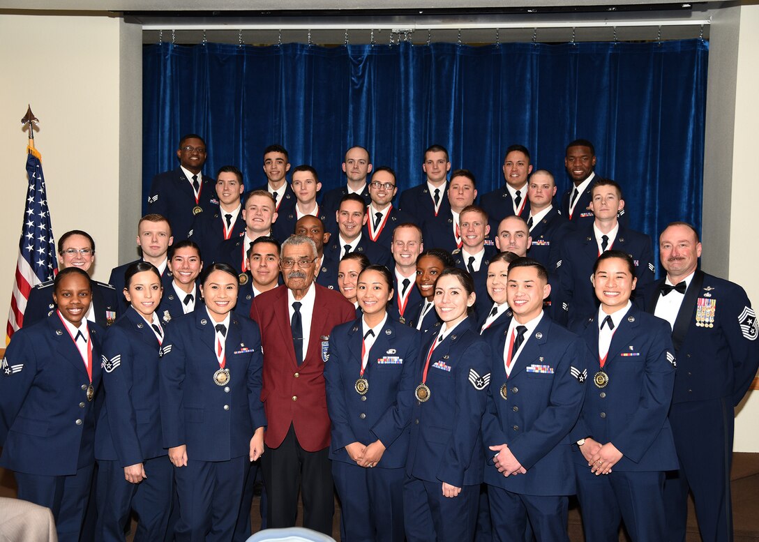 Col. Stacy Jo Huser, 90th Missile Wing commander, Chief Master Sgt. Kristian Farve, 90th Missile Wing Command Chief, and special guest speaker and Tuskegee Airman Frank Macon pose with the graduating Airman Leadership School Class 19-C students in the Trail's End Event Center on F.E. Warren Air Force Base, Wyo., Feb. 13, 2019. Enlisted Airmen must complete the rigorous professional military education course before supervising other Airmen.