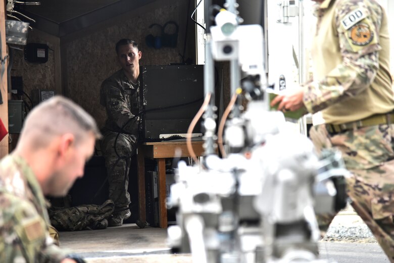 U.S. Air Force Capt. Wes Gray, 380th Expeditionary Civil Engineer Squadron Explosive Ordnance Disposal flight commander, monitors a F6A Andros robot during proficiency training at Al Dhafra Air Base, United Arab Emirates, Feb. 12, 2019. EOD Airmen are required to train for 24 hours a week to stay efficient in their craft. (U.S. Air Force photo by Senior Airman Mya M. Crosby)