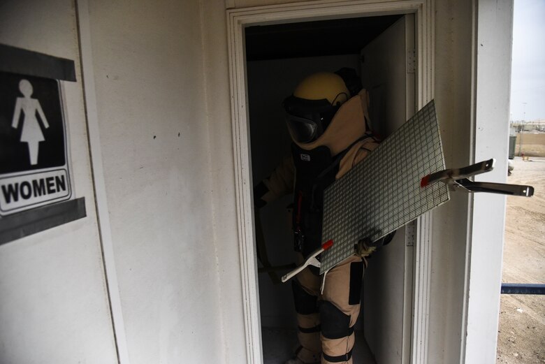 U.S. Air Force Staff Sgt. Mike Kealty, 380th Expeditionary Civil Engineer Squadron Explosive Ordnance Disposal flight EOD member, carries a grid aim system during proficiency training at Al Dhafra Air Base, United Arab Emirates, Feb. 12, 2019. EOD Airmen have the capability to locate, identify, disarm, neutralize, recover, and dispose of hazardous explosives. (U.S. Air Force photo by Senior Airman Mya M. Crosby)