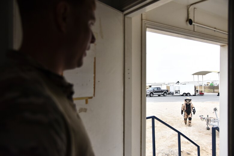 U.S. Air Force Staff Sgt. Jeff Quick, 380th Expeditionary Civil Engineer Squadron Explosive Ordnance Disposal flight EOD team leader, supervises Staff Sgt. Mike Kealty, 380th ECES EOD flight EOD team member, during proficiency training at Al Dhafra Air Base, United Arab Emirates, Feb. 12, 2019. EOD Airmen serve as a member of base emergency response team and provide the ability to detect, monitor, evaluate, and decontaminate explosive, radioactive, chemical, or biological ordnance hazards. (U.S. Air Force photo by Senior Airman Mya M. Crosby)