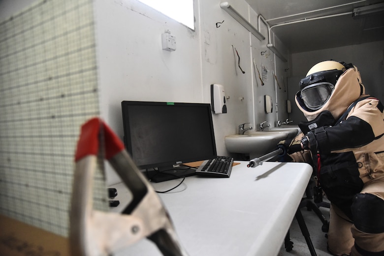 U.S. Air Force Staff Sgt. Mike Kealty, 380th Expeditionary Civil Engineer Squadron Explosive Ordnance Disposal flight EOD team member, sets up a disruptor during proficiency training at Al Dhafra Air Base, United Arab Emirates, Feb. 12, 2019. EOD Airmen have the capability to locate, identify, disarm, neutralize, recover, and dispose of hazardous explosives. (U.S. Air Force photo by Senior Airman Mya M. Crosby)