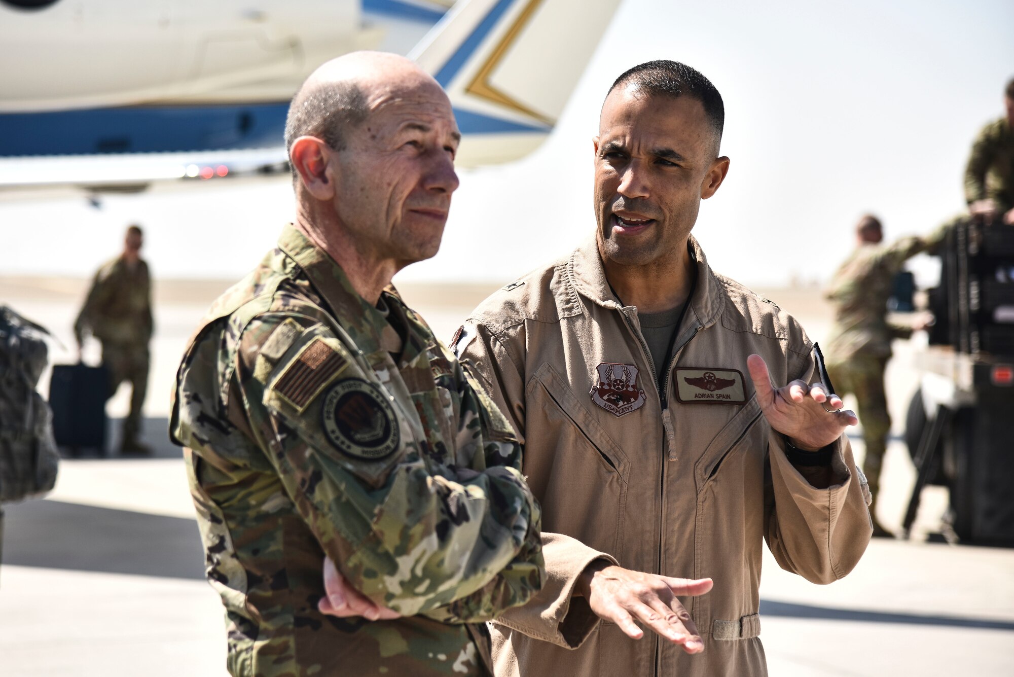 U.S. Air Force Brig. Gen. Adrian Spain, 380th Air Expeditionary Wing commander, speaks to Gen. Mike Holmes, commander of Air Combat Command, at Al Dhafra Air Base, United Arab Emirates, Feb. 14, 2019. The 380th AEW’s mission is to conduct combat operations directed by the President to provide high-altitude all-weather intelligence, surveillance, reconnaissance, airborne command and control and air refueling for Operations Inherent Resolve and Resolute Support.(U.S. Air Force photo by Senior Airman Mya M. Crosby)