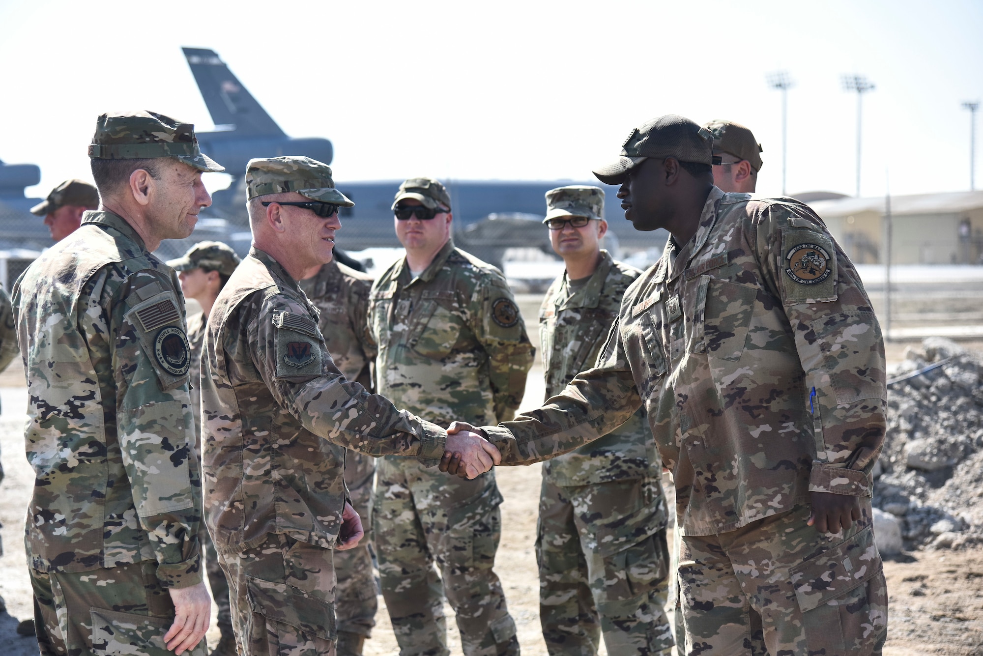 U.S. Air Force Chief Master Sgt. Frank Batten III, Air Combat Command command chief, greets Tech. Sgt. Asa Oliver IV, 380th Expeditionary Civil Engineer Squadron, upon arrival at Al Dhafra Air Base, United Arab Emirates, Feb. 14, 2019. Batten and Gen. Mike Holmes, commander of Air Combat Command, were immersed in the 380th mission, met with Airmen and recognized top performers during their time at Al Dhafra. (U.S. Air Force photo by Senior Airman Mya M. Crosby)