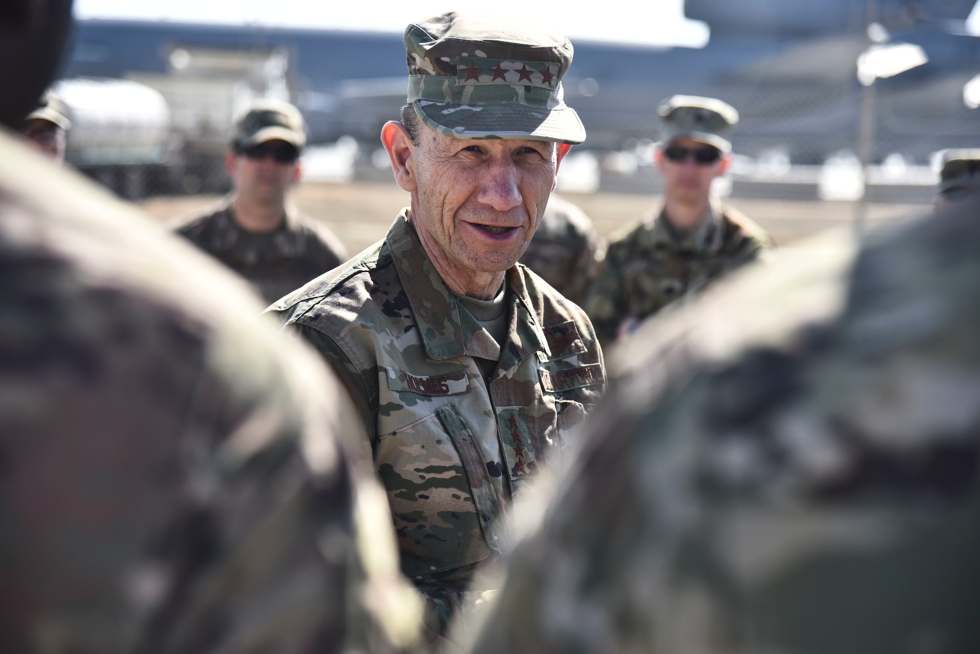 U.S. Air Force Gen. Mike Holmes, commander of Air Combat Command, speaks to Airmen assigned to the 380th Air Expeditionary Wing at Al Dhafra Air Base, United Arab Emirates, Feb. 14, 2019. As the commander of ACC, Holmes is responsible for organizing, training, and equipping the Airmen who fight in and from multiple domains to control the air, space, and cyberspace. (U.S. Air Force photo by Senior Airman Mya M. Crosby)