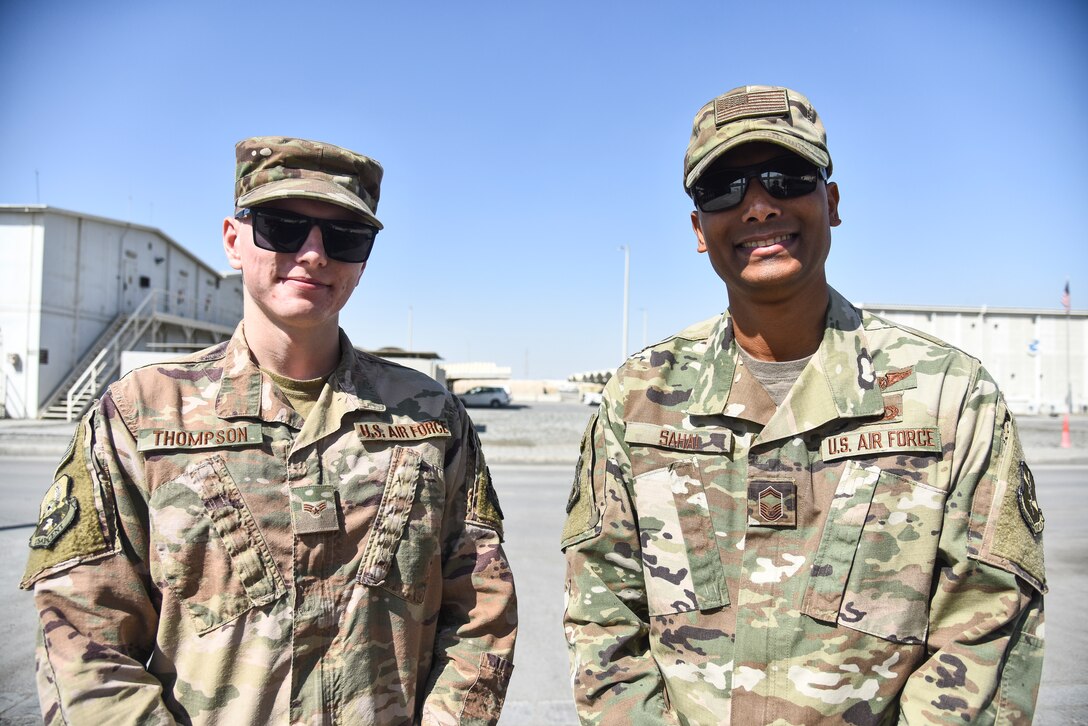 Senior Airman Kyle Thompson, 380th Expeditionary Security Forces Squadron force protection escort, and Senior Master Sgt. Troy Sahai, 380th Air Expeditionary Wing command post superintendent, pose for a photo at Al Dhafra Air Base, United Arab Emirates, Feb. 14, 2019. There are Professional Development Teams at almost every Air Force installation, where NCOs groom junior Airman into future professional leaders. (U.S. Air Force photo by Senior Airman Mya M. Crosby)