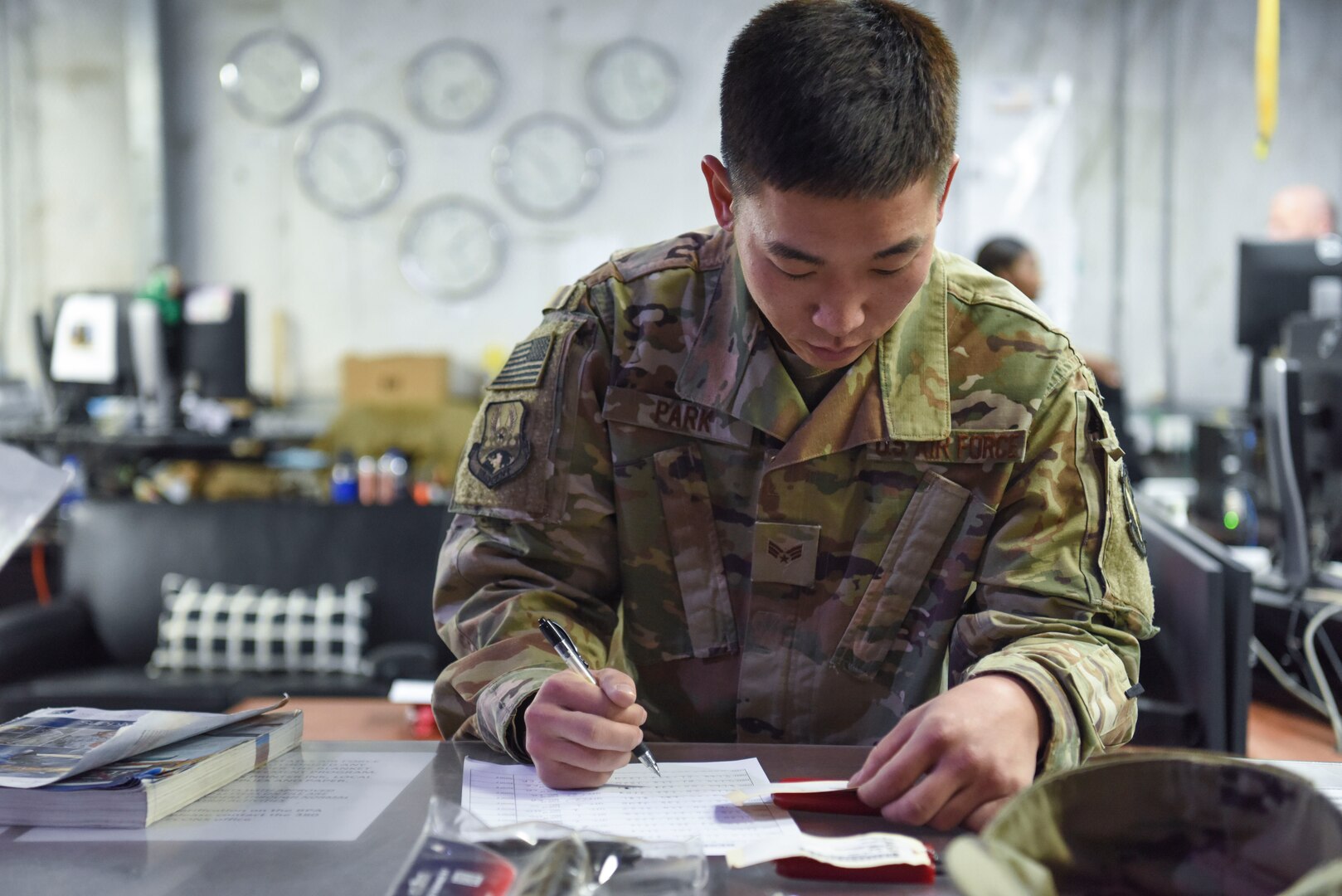 Senior Airman Minkyu Park, 380th Expeditionary Logistics Readiness Squadron customer service technician, checks the ordering number while issuing supplies at Al Dhafra Air Base, United Arab Emirates, Feb. 11, 2019.