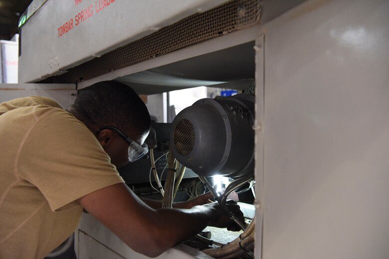 Staff Sgt. Evan Rose, 380th Expeditionary Maintenance Squadron Aerospace Ground Equipment craftsman, installs a fuels control unit onto a Dash 60 generator, Feb. 11, 2019, at Al Dhafra Air Base, United Arab Emirates.
