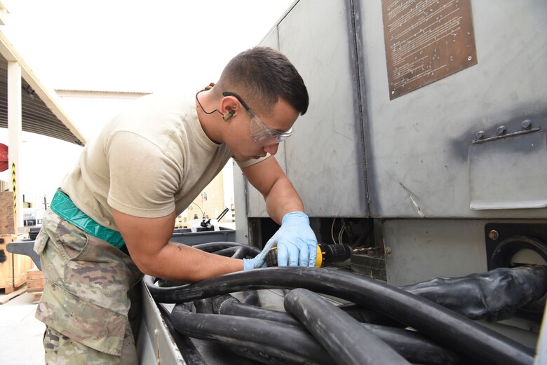 Airman 1st Class Quentin Kern, 380th Expeditionary Maintenance Squadron Aerospace Ground Equipment technician, drills a rivet nut into a stripped hole to replace a panel of a DASH 86 generator, Feb. 11, 2019, at Al Dhafra Air Base, United Arab Emirates.