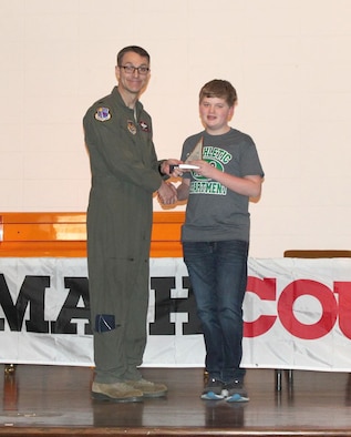 Alex Dixon, pictured right, receiving his first place individual award from AEDC Commander Col. Scott Cain, for the skills he displayed during the MathCounts® Competition held Feb. 2 at the University of Tennessee Space Institute. The MathCounts® Competition is sponsored by the Tullahoma Chapter of the Tennessee Society of Professional Engineers. (Courtesy photo)