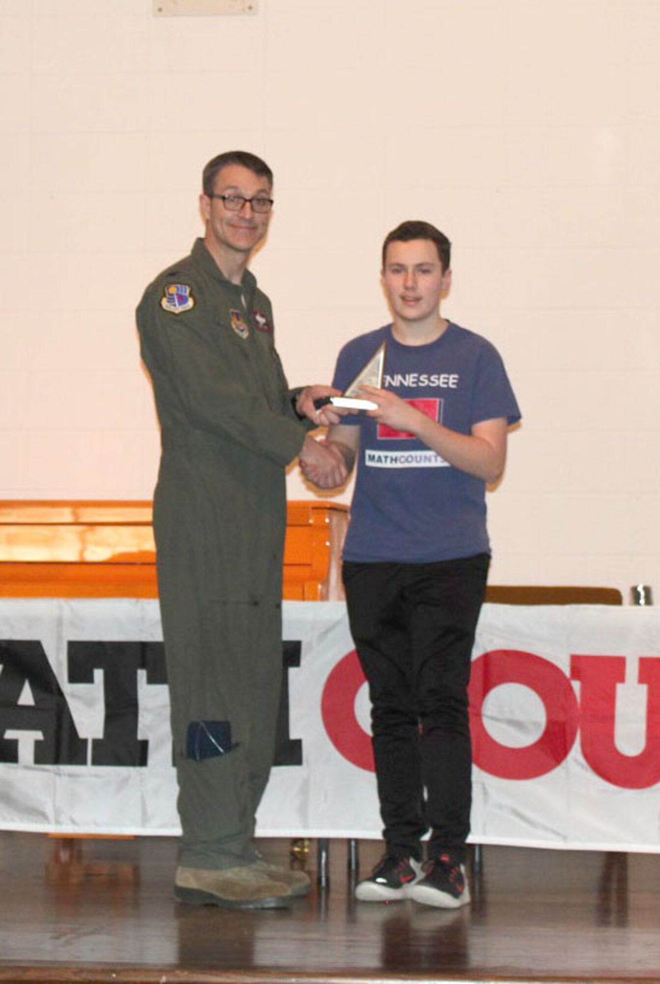 Jackson Banks, pictured right, receiving his second place individual award from the MathCounts® Regional Competition from AEDC Commander Col. Scott Cain. The MathCounts® Competition, held Feb. 2 at the University of Tennessee Space Institute, is sponsored by the Tullahoma Chapter of the Tennessee Society of Professional Engineers. (Courtesy photo)