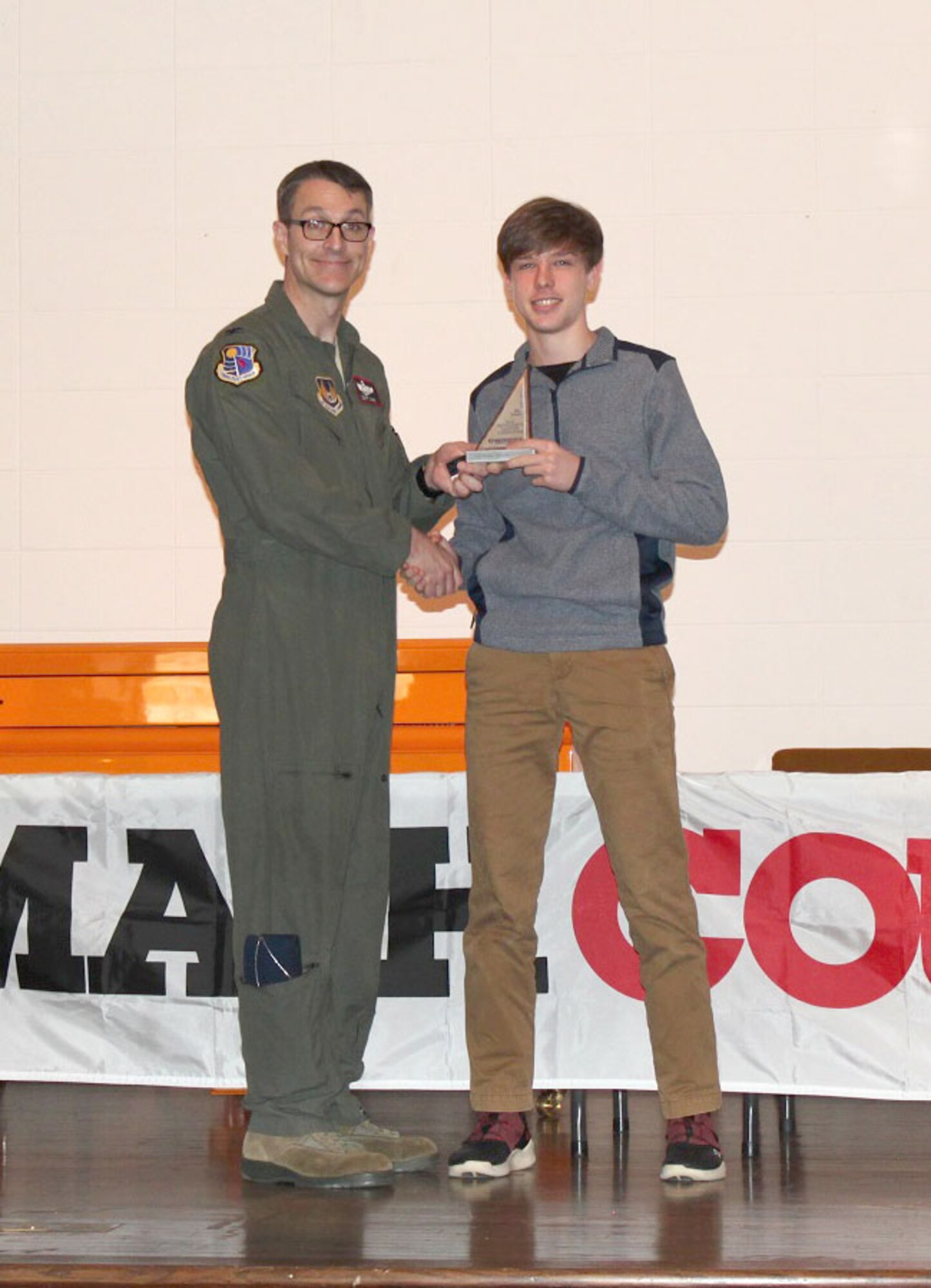 Zane Hopf, pictured right, receiving his third place individual award from the MathCounts® Regional Competition from AEDC Commander Col. Scott Cain. The MathCounts® Competition, held Feb. 2 at the University of Tennessee Space Institute, is sponsored by the Tullahoma Chapter of the Tennessee Society of Professional Engineers. (Courtesy photo)