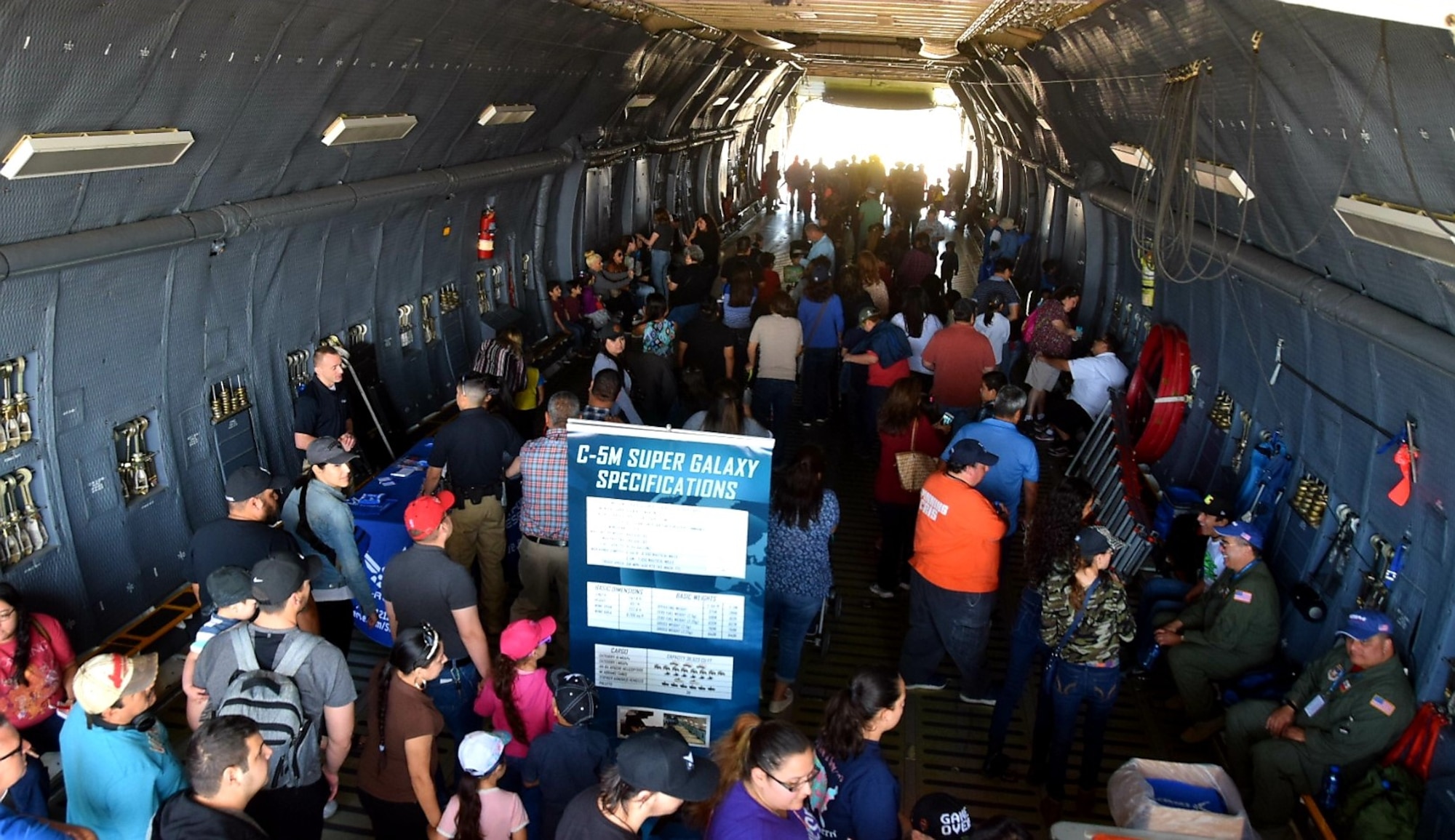 Washington’s Birthday Celebration Association Stars and Stripes Air Show Spectacular attendees walk through the 433rd Airlift Wing’s C-5M Super Galaxy from Joint Base San Antonio-Lackland, Texas at the at the Laredo International Airport in Laredo, Texas Feb. 17, 2019.