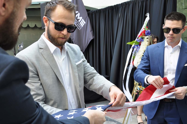 Paul Lilley, an Army veteran, actor, producer and member of Veterans in Media and Entertainment, center, helps fold a flag to present to “Agents of Mayhem” “Legion M” and “POW! Entertainment!” during “Excelsior! A Celebration of the Amazing, Fantastic, Incredible and Uncanny Life of Stan Lee” Jan. 30 at the TCL Chinese Theatre in Hollywood, California. The event was a memorial tribute to Stan Lee, Marvel comic book writer, editor, publisher and co-creator, who died in November 2018. Lee was an Army veteran and former writer in the U.S. Army Signal Corps during World War II. The flags presented to the three organizations were flown over Iraq by Maj. Scotty Autin, deputy commander of the U.S. Army Corps of Engineers Los Angeles District, during his last deployment. A flag also was presented to Lee's daughter, J.C., on the Red Carpet.