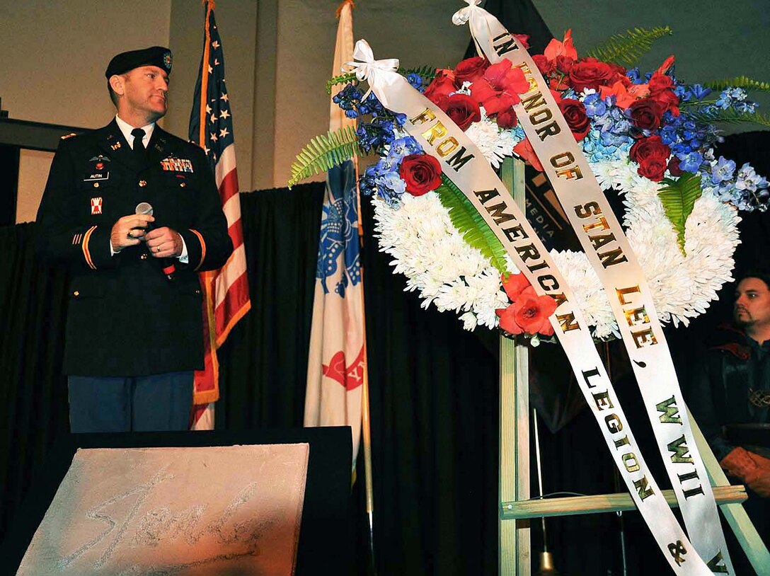 Maj. Scotty Autin, deputy commander, U.S. Army Corps of Engineers Los Angeles District, reflects in the background of a wreath honoring the late Marvel comic book legend Stan Lee during “Excelsior! A Celebration of the Amazing, Fantastic, Incredible and Uncanny Life of Stan Lee” Jan. 30 at the TCL Chinese Theatre in Hollywood, California. The event was a memorial tribute to Lee, Marvel comic book writer, editor, publisher and co-creator, who died in November 2018. Lee was an Army veteran and former writer in the U.S. Army Signal Corps during World War II.