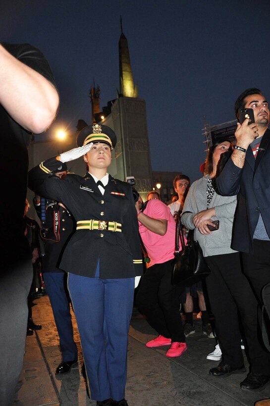 A military service member salutes the U.S. flag during the playing of “Taps” at “Excelsior! A Celebration of the Amazing, Fantastic, Incredible and Uncanny Life of Stan Lee” Jan. 30 at the TCL Chinese Theatre in Hollywood, California. The event was a memorial tribute to Stan Lee, Marvel comic book writer, editor, publisher and co-creator, who died in November 2018. Lee was an Army veteran and former writer in the U.S. Army Signal Corps during World War II.