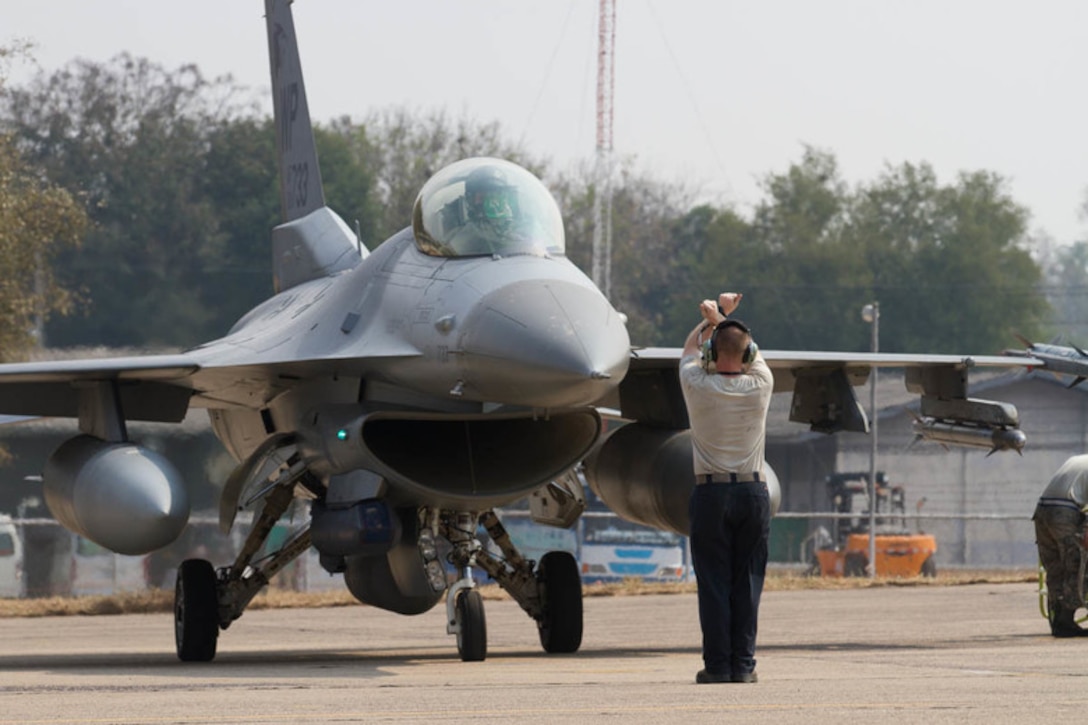 U.S. Air Force F-16 Fighting Falcon, assigned to the 35th Fighter Squadron, Republic of Korea, is marshaled in prior to Exercise Cobra Gold 2019 at Korat Royal Thai Air Force Base, Thailand, Feb. 6, 2019. Cobra Gold provides a venue for both U.S. and partner nations to advance interoperability and increase partner capacity in planning and executing complex and realistic multinational force and combined task force operations. (U.S. Army photo by Spc. Valencia McNeal)