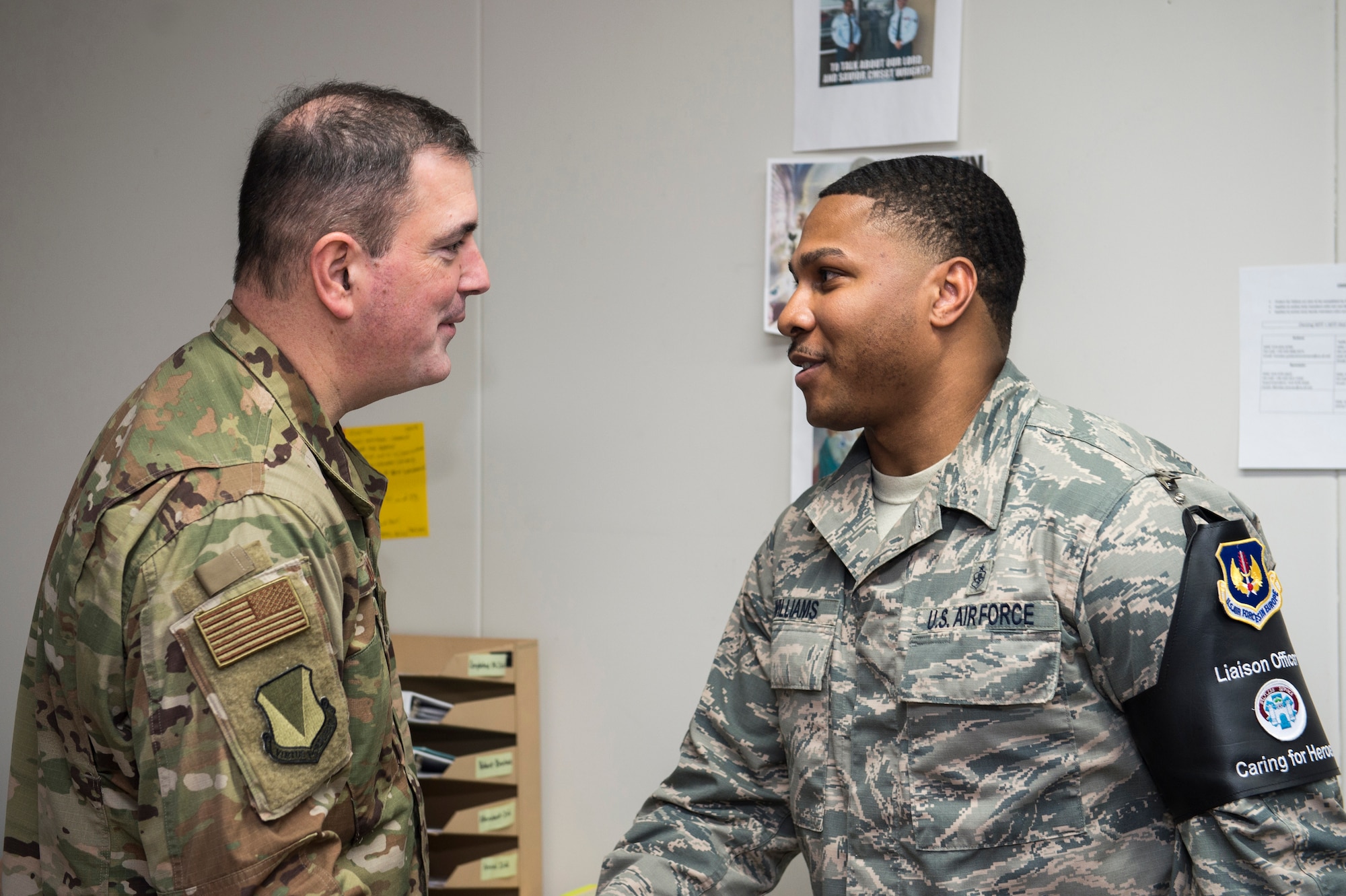 U.S. Air Force Staff Sgt. Antwan Williams, 86th Medical Squadron Air Force Liaison Officer, is recognized by U.S. Air Force Brig. Gen. Mark R. August, 86th Airlift Wing commander, for being the 86th AW’s Airlifter of the Week at Landstuhl Regional Medical Center, Germany, Feb. 14, 2019. Williams went above and beyond his normal duties providing advanced medical and quality of life care for two patients being airlifted home. (U.S. Air Force photo by Staff Sgt. Jonathan Bass)