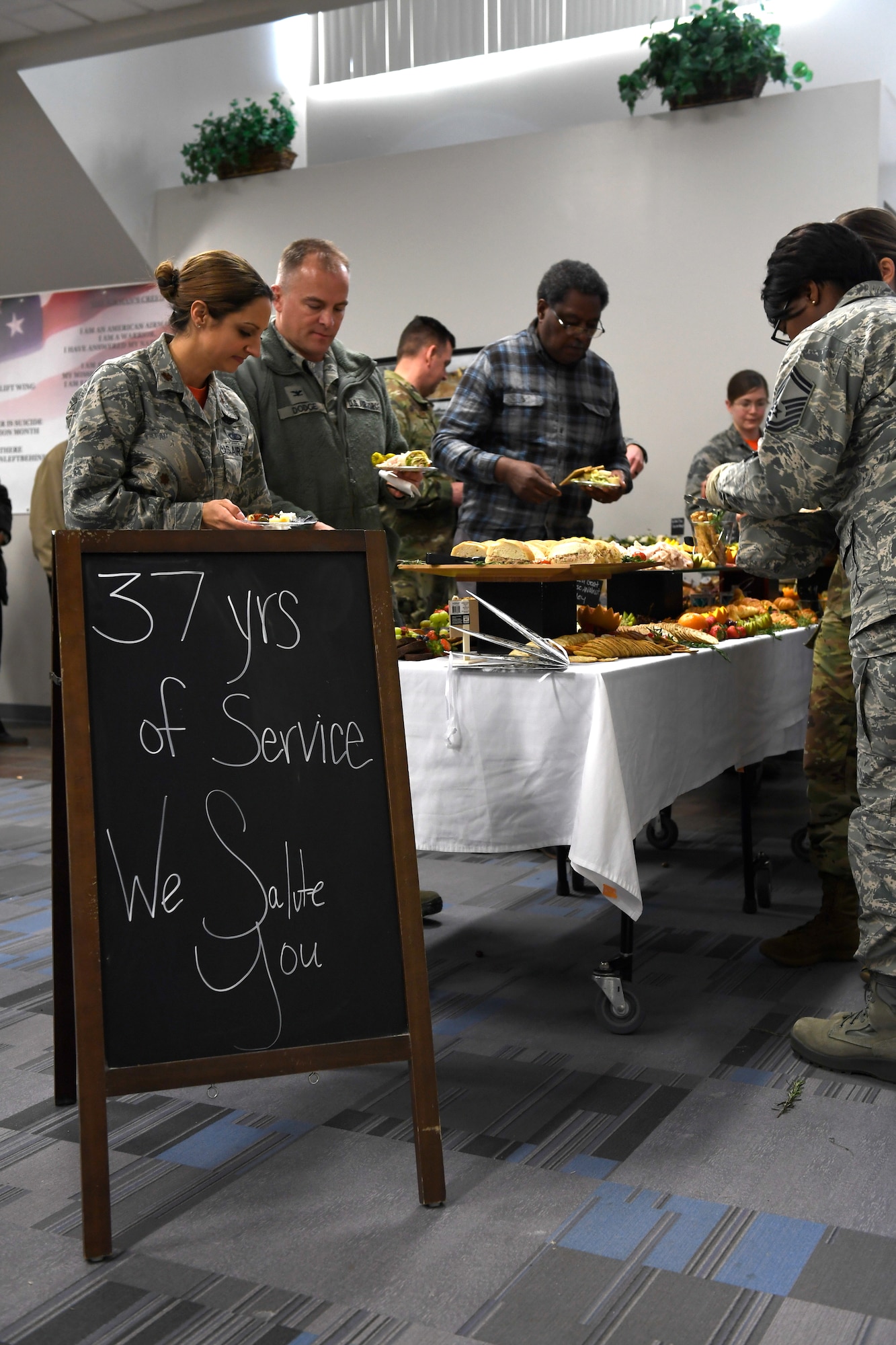 A sign displays a special salute to U.S. Air Force Brig. Gen. Clarence Ervin’s 37-year military service during the retirement reception at the North Carolina Air National Guard Base (NCANG), Charlotte Douglas International Airport, Feb. 09, 2019. Family, friends and guard members gathered to celebrate the retirement of Gen. Ervin, Chief of Staff for the NCANG.