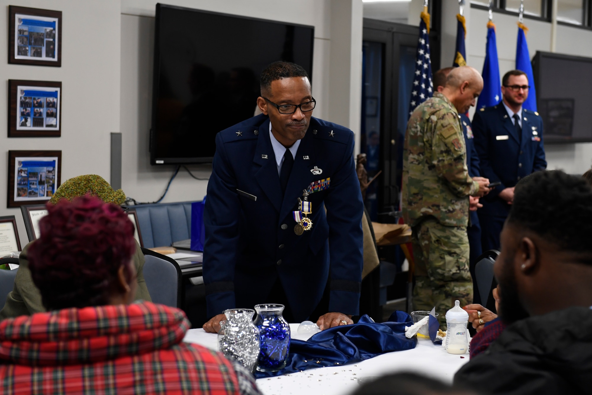 U.S. Air Force Brig. Gen. Clarence Ervin talks to family members during the retirement reception at the North Carolina Air National Guard Base (NCANG), Charlotte Douglas International Airport, Feb. 09, 2019. Family, friends and guard members gathered to celebrate the retirement of Gen. Ervin, Chief of Staff for the NCANG, after serving in the military for 37 years.