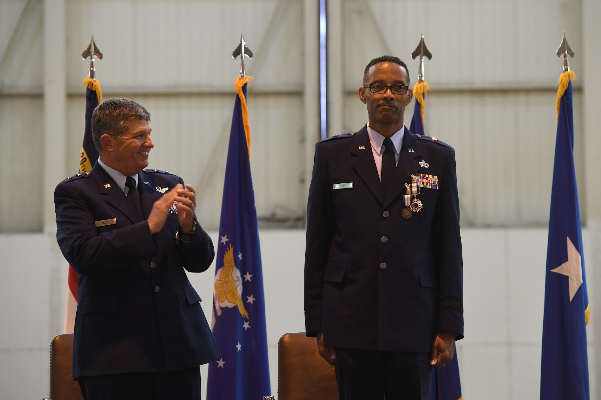 U.S. Air Force Maj. Gen., Retired, Todd Kelly applauds Brig. Gen. Clarence Ervin during his retirement ceremony at the North Carolina Air National Guard Base (NCANG), Charlotte Douglas International Airport, Feb. 09, 2019. Family, friends and guard members gathered to celebrate the retirement of Gen. Ervin, Chief of Staff for the NCANG, after serving in the military for 37 years.