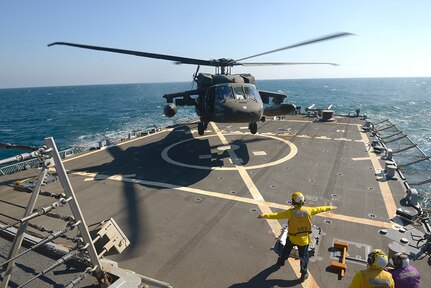 Aviators with the Minnesota, Texas and Utah National Guards, led by the Kansas National Guard’s 1st Battalion, 108th Aviation Regiment, practice landing and taking off during deck landing qualification training aboard the Arleigh Burke-class guided-missile destroyer USS Mitscher (DDG 57) in the Arabian Gulf on Feb. 4, 2019.