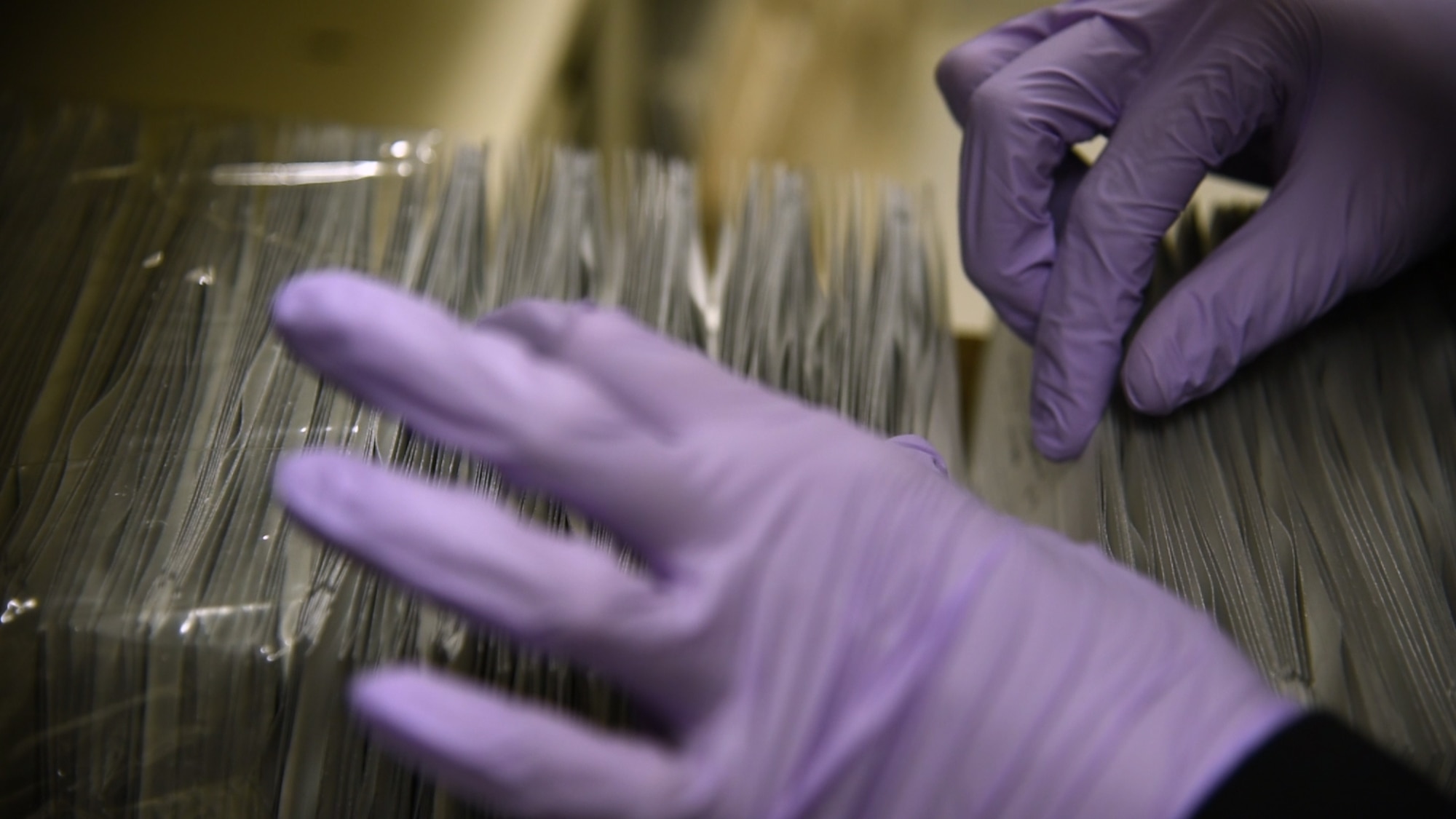 Tierra Woodberry, Armed Forces Medical Examiner System (AFMES) DNA specimen processor, searches for a blood stain card in a row of 500 Jan. 30, 2019, at the Armed Forces Repository of Specimen Samples for the Identification of Remains on Dover Air Force Base, Del. Armed Forces Medical Examiner System personnel use blood stain cards to accurately identify the remains of fallen service members. (U.S. Air Force Photo by Senior Airman Dedan D. Dials)