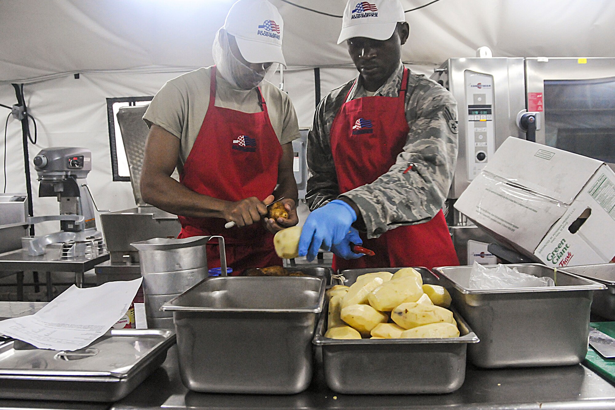 Participants peel potatoes during this year's Hennessy competition held at the Force Support Silver Flag training facility on Dobbins Air Reserve Base Feb. 9-12. Each year a trophy is awarded to teams representing the best food service programs in the Air Force and is based on the entire scope of an installation's food service program. (U.S. Air Force photo/Senior Airman Justin Clayvon)