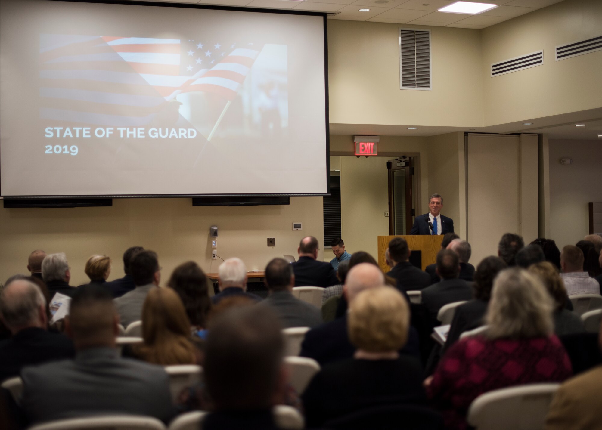 Governor John Carney speaks to attendees during the State of the Guard Event at Joint Force Headquarters, New Castle, Del., Feb. 15, 2019. During the event, members from the Delaware State Chamber of Commerce and the New Castle County Chamber of Commerce joined with members from the Delaware National Guard to discuss current missions, activities and operations of the DNG. (U.S. Air National Guard photo by Senior Airman Katherine Miller)
