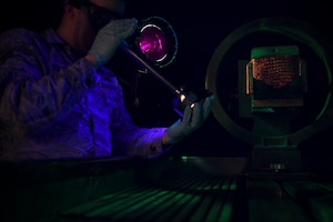 U.S. Air Force Airman 1st Class Jacob Boer, 1st Maintenance Squadron non-destructive inspection journeyman examines equipment parts at Joint Base Langley-Eustis, Virginia, Feb. 15, 2019.