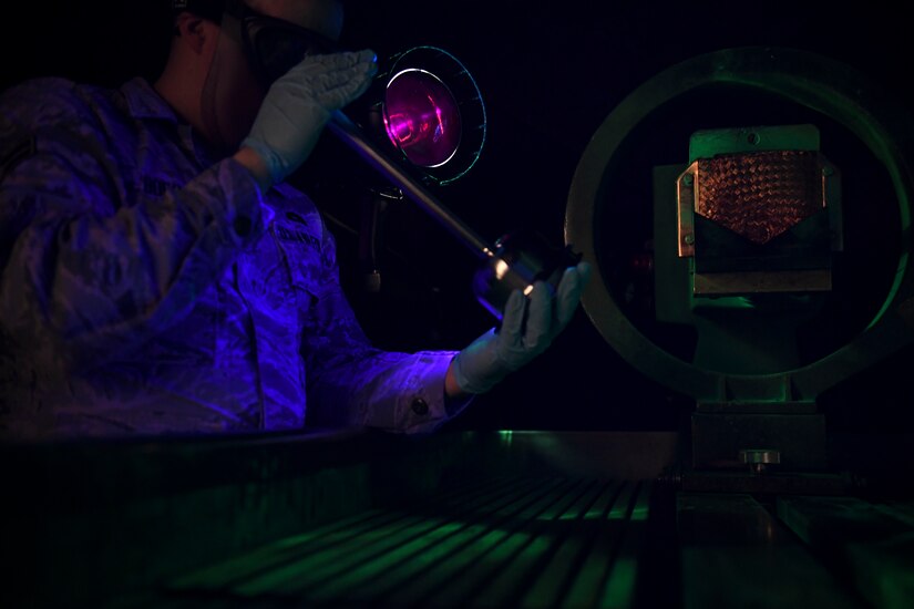 U.S. Air Force Airman 1st Class Jacob Boer, 1st Maintenance Squadron non-destructive inspection journeyman examines equipment parts at Joint Base Langley-Eustis, Virginia, Feb. 15, 2019.