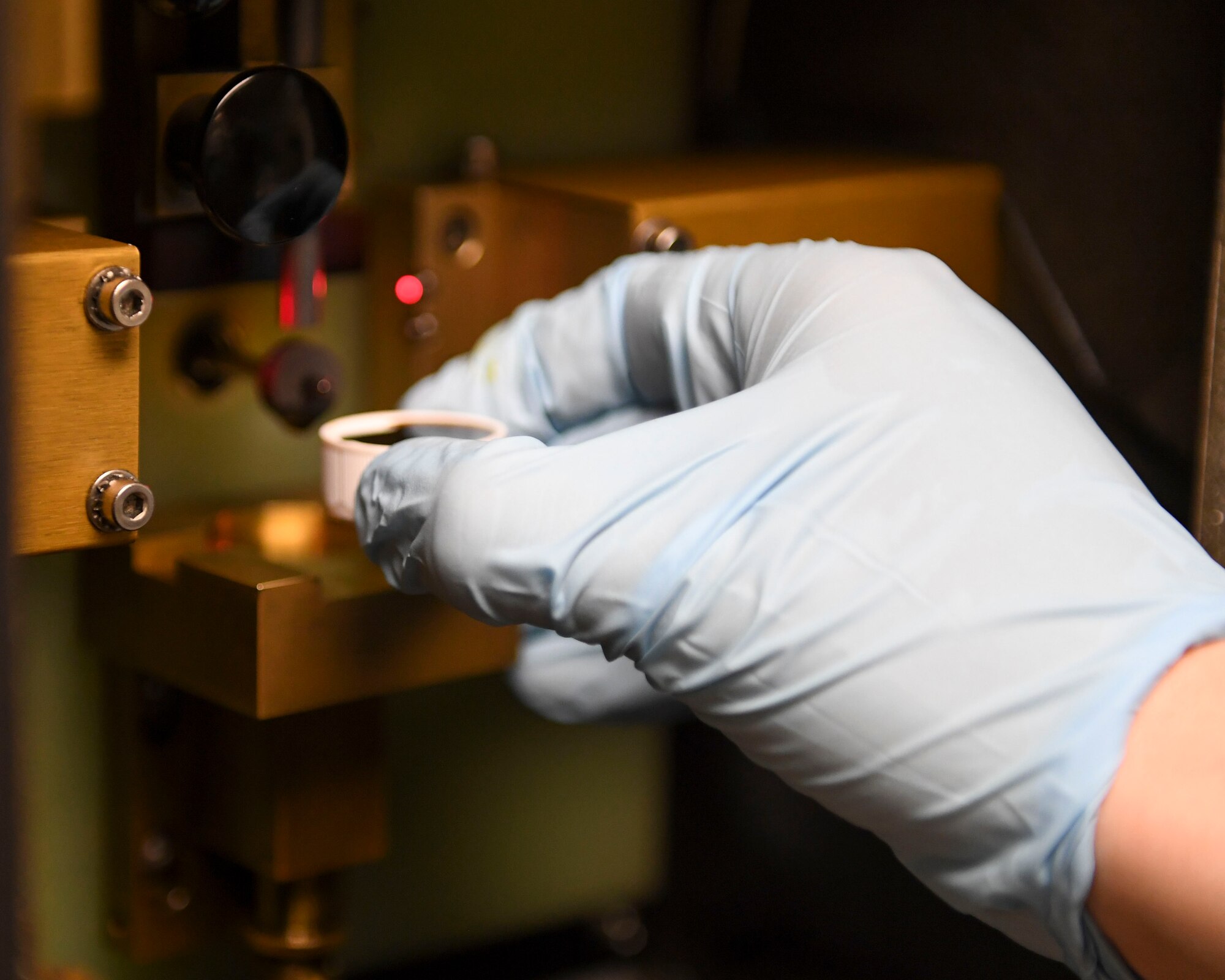 U.S. Air Force Airman 1st Class Jacob Boer, 1st Maintenance Squadron non-destructive inspection journeyman, tests oil at Joint Base Langley-Eustis, Virginia, Feb. 15, 2019.