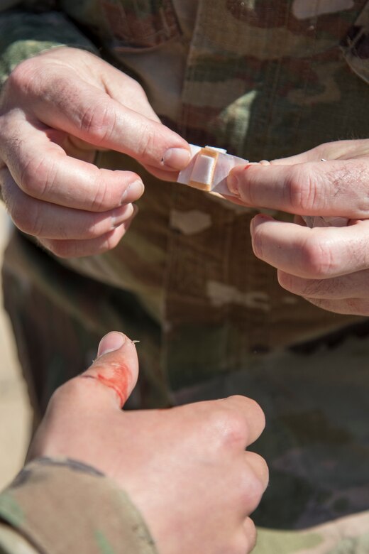 A United States Army physician assistant applies medical care to a student during day seven of Air Assault School’s Class 301-19 on Feb. 12, 2019, at Camp Buehring, Kuwait. Soldiers assigned to U.S. Army Central operate in a dynamic environment requiring the right forces in place, including medical support, to respond to crisis or contingencies anywhere in the world.