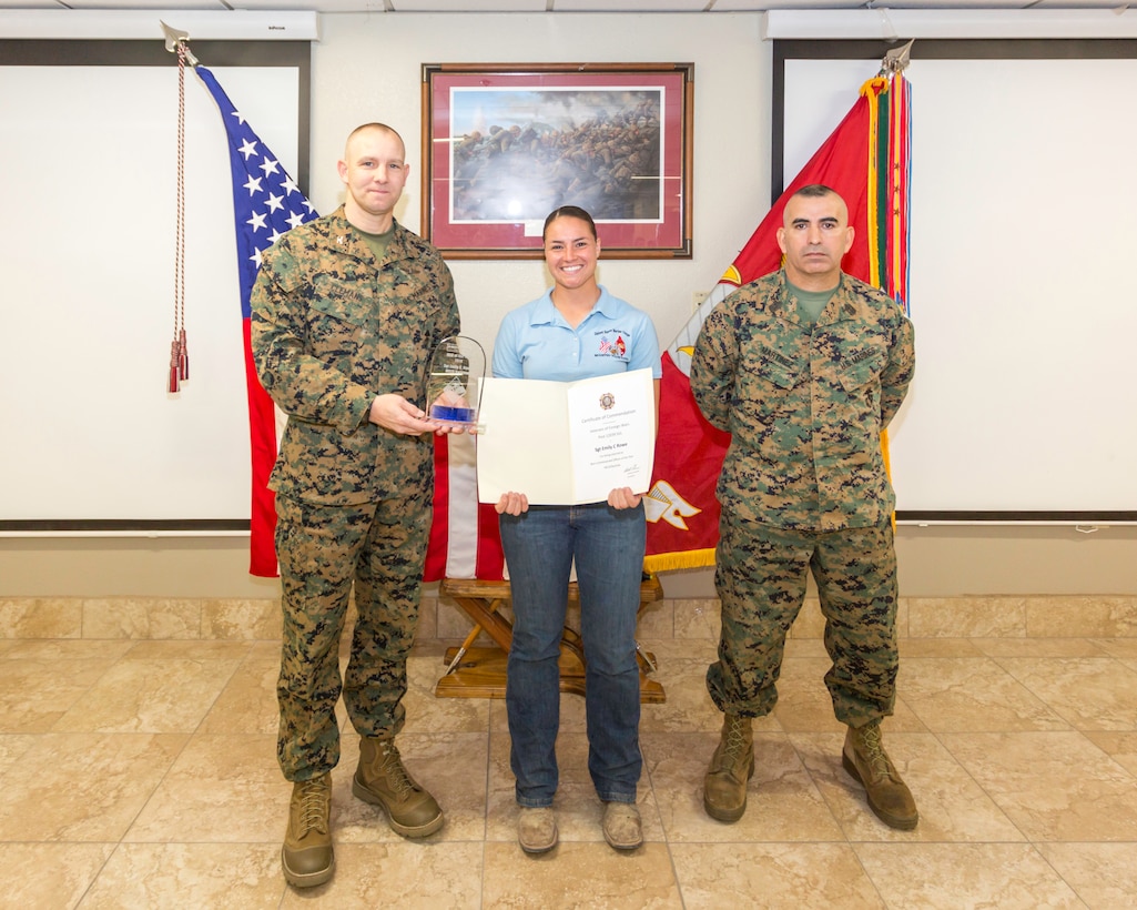 Sergeant Emily Rowe, stableman, was awarded Noncommissioned Officer of the Year by Col. Craig Clemans, Base Commander, and Sgt. Maj. Sergio MartinezRuiz, Base Sergeant Major, during the quarterly awards breakfast aboard Marine Corps Logistics Base Barstow, Calif., Jan. 29.
(U.S. Marine Corps Photo by Jack J. Adamyk)