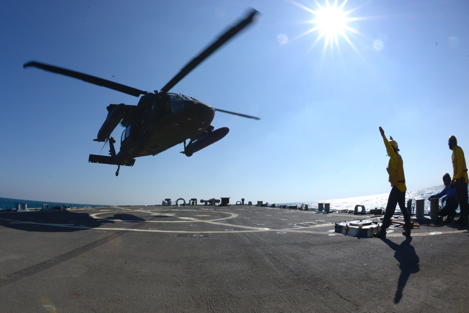 Aviators with the Minnesota, Texas and Utah National Guards, led by the Kansas National Guard’s 1st Battalion, 108th Aviation Regiment, practice landing and taking off during deck landing qualification training aboard the Arleigh Burke-class guided-missile destroyer USS Mitscher (DDG 57) in the Arabian Gulf on Feb. 4, 2019.