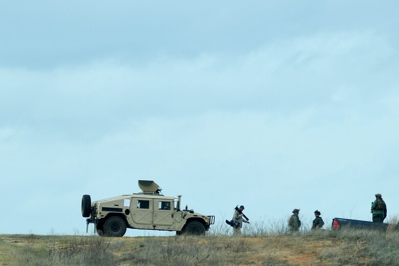Contingency Response Forces assigned to the 821st Contingency Response Group out of Travis Air Force Base, Calif., secure the perimeter around the Geronimo Landing Zone during a mission in support of Green Flag Little Rock exercise, Feb. 11, 2019, Fort Polk, La. The primary objective of the exercise is to support the Joint Readiness Training Center and provide the maximum number of airlift crews, mission planners and ground support elements to a simulated combat environment with emphasis on joint force integration. (U.S. Air Force photo by Tech. Sgt. Liliana Moreno)