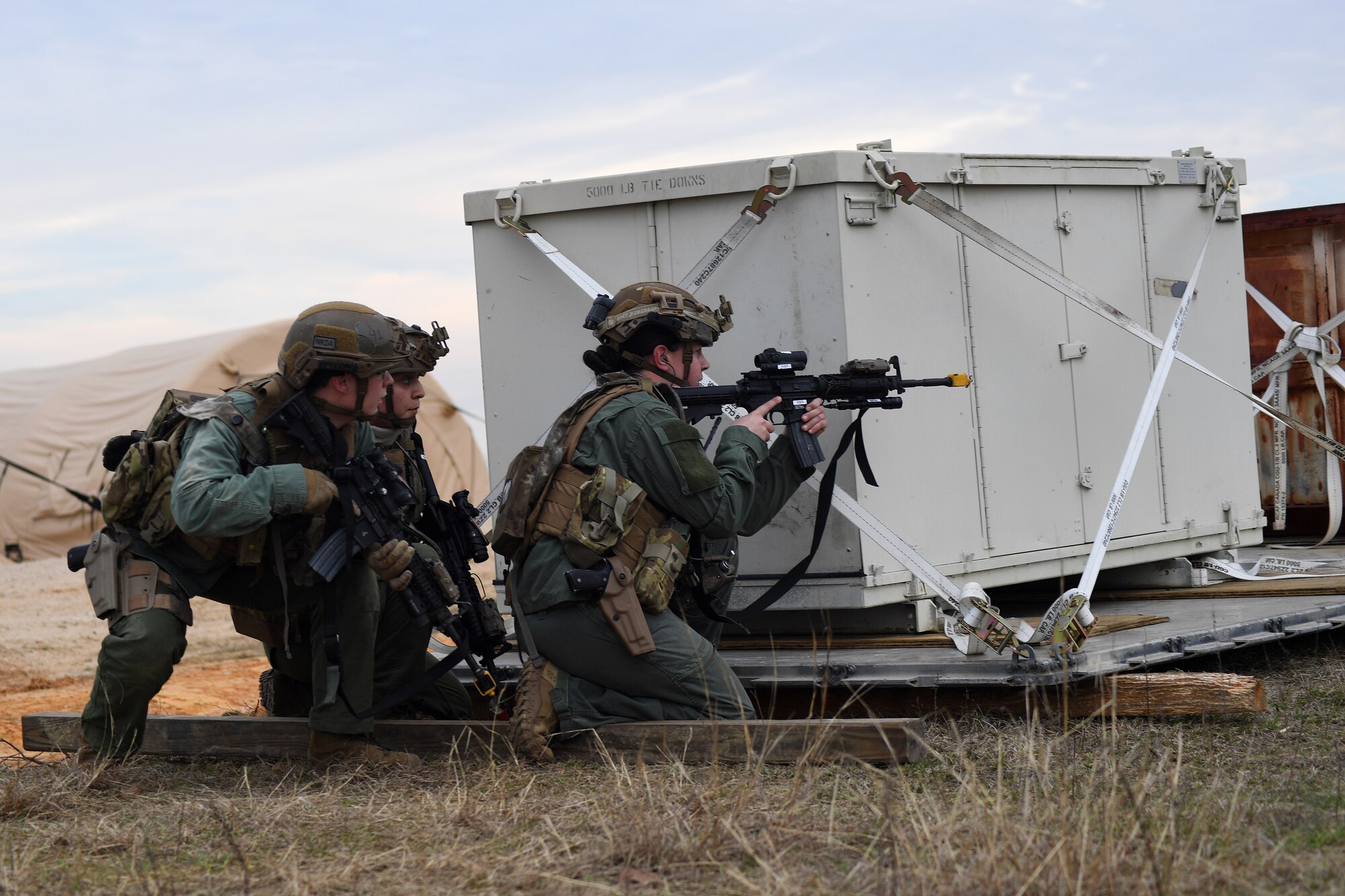 Contingency Response Forces assigned to the 821st Contingency Response Group out of Travis Air Force Base, Calif., respond to a simulated gunfire attack at the Geronimo Landing Zone during a mission in support of Green Flag Little Rock exercise, Feb. 11, 2019, Fort Polk, La. The primary objective of the exercise is to support the Joint Readiness Training Center and provide the maximum number of airlift crews, mission planners and ground support elements to a simulated combat environment with emphasis on joint force integration. (U.S. Air Force photo by Tech. Sgt. Liliana Moreno)