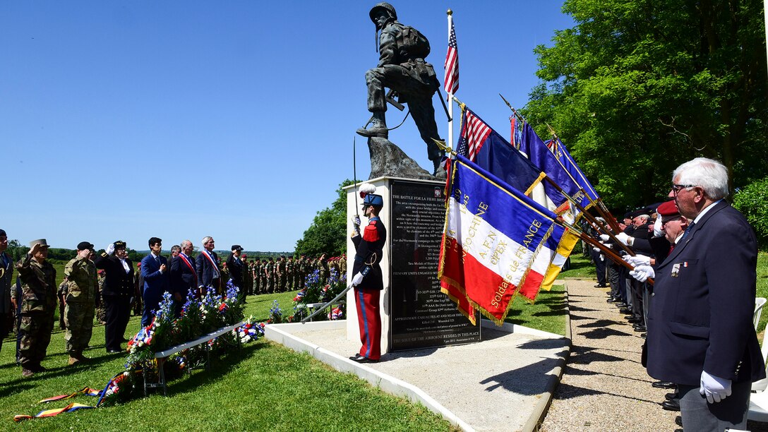 WWII veterans and local leaders gathered at the “Iron Mike” statue