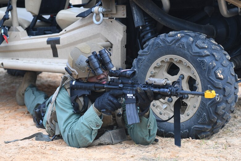 Staff Sgt. Malcom Mullen, 921st Contingency Response Squadron security forces, responds to a simulated gunfire attack at the Geronimo Landing Zone during a mission in support of Green Flag Little Rock exercise, Feb. 11, 2019, Fort Polk, La. The primary objective of the exercise is to support the Joint Readiness Training Center and provide the maximum number of airlift crews, mission planners and ground support elements to a simulated combat environment with emphasis on joint force integration. (U.S. Air Force photo by Tech. Sgt. Liliana Moreno)