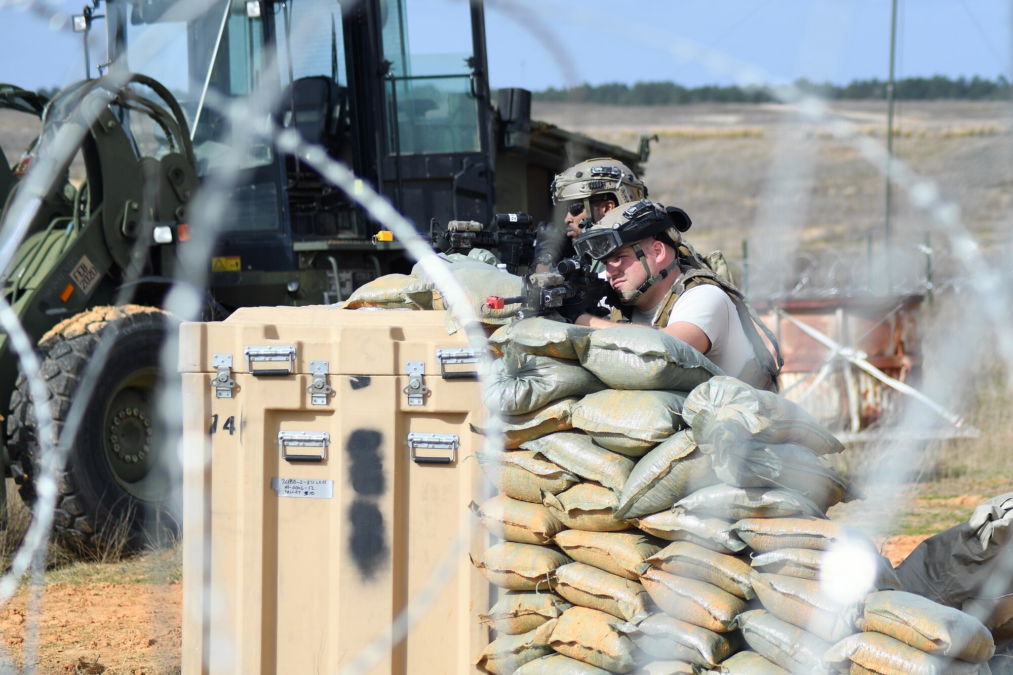 Contingency Response Forces assigned to the 821st Contingency Response Group out of Travis Air Force Base, Calif., secure the perimeter around the Geronimo Landing Zone during a mission in support of Green Flag Little Rock exercise, Feb. 14, 2019, Fort Polk, La. The primary objective of the exercise is to support the Joint Readiness Training Center and provide the maximum number of airlift crews, mission planners and ground support elements to a simulated combat environment with emphasis on joint force integration. (U.S. Air Force photo by Tech. Sgt. Liliana Moreno)